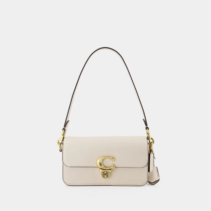 Coach bags with a zippered interior pocket for separating itemsHobo Studio Baguette - Coach - Leather - Beige