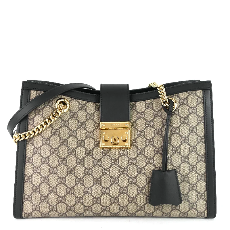 Women Gucci Sylvie bags with a crystal - embellished web stripePadlock Medium GG Supreme Canvas Bag