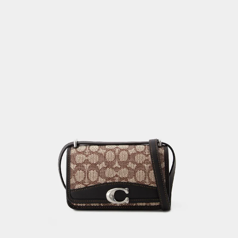 Coach bags with a front - zip pocket for small items like keys and cardsBandit Crossbody - Coach - Leather - Cocoa Black