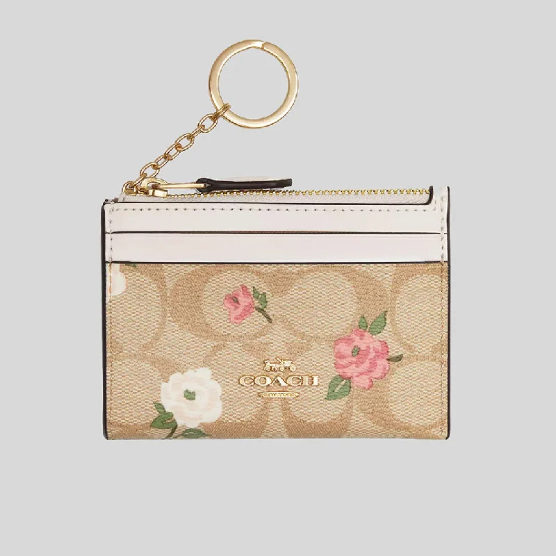 Coach handbags with a perforated leather detail for a breathable and unique designCOACH Mini Skinny Id Case In Signature Canvas With Floral Print CR972