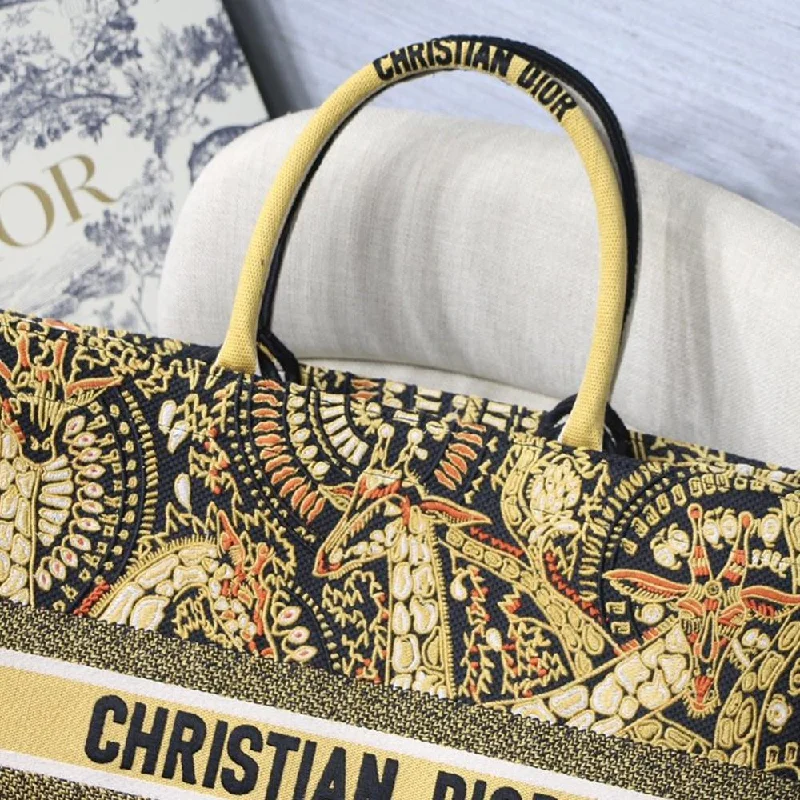 Christian Dior handbags with a snap - button closure and a decorative buckleDIOR BOOK TOTE